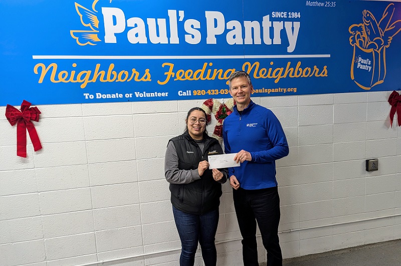 Stephanie Martinez of Paul's Pantry receives donation from GreenLeaf Bank